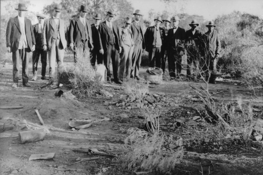 Detectives look at the murder scene of Detective-Inspector John Walsh and Detective-Sergeant Alexander Pitman.