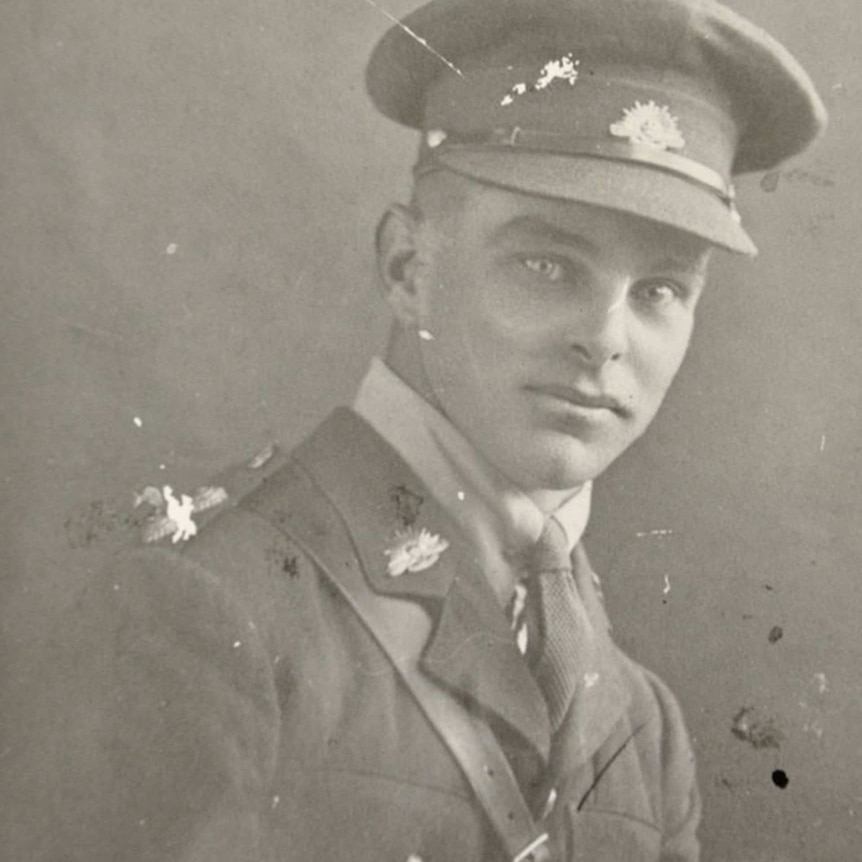 A black and white portrait photo of a man in a RAAF uniform.