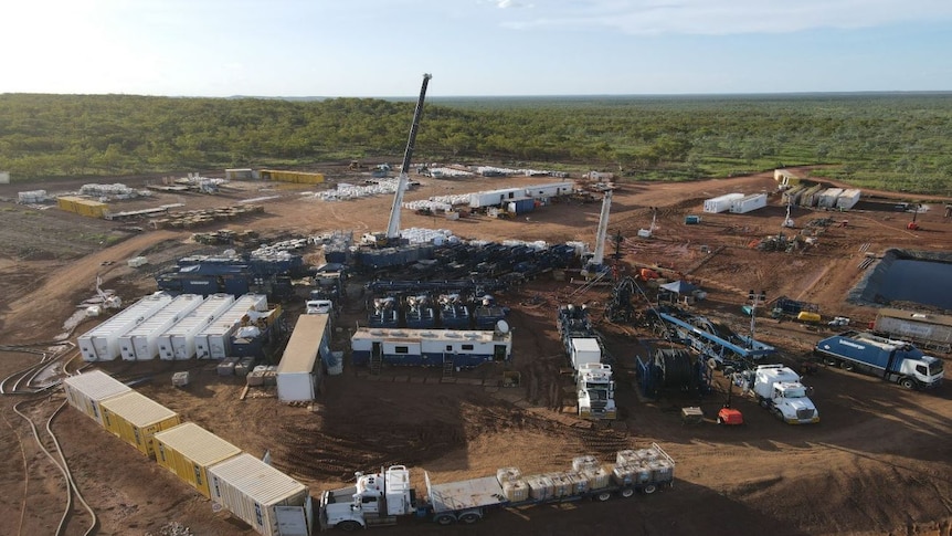 an aerial shot of mining and drilling equipment at a gas exploration well.