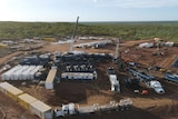 an aerial shot of mining and drilling equipment at a gas exploration well.