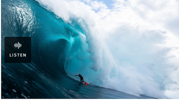 A surfer in the eye of the barrelo of a massive wave. Has Audio.