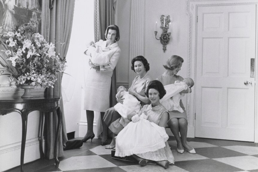 Queen Elizabeth II, Princess Margaret, Princess Alexandra and The Duchess of Kent hold their babies in 1964