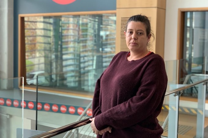 Karis Graham stands outside the ABC Radio Perth booth