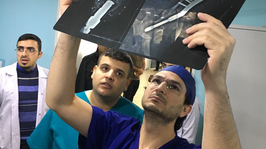 Professor Munjed Al Muderis inspecting x-ray