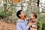 Jay Ong and his daughter playing outside in autumn, in story about childhood hobbies people are rediscovering during COVID.