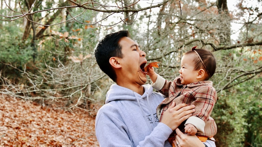 Jay Ong and his daughter playing outside in autumn, in story about childhood hobbies people are rediscovering during COVID.