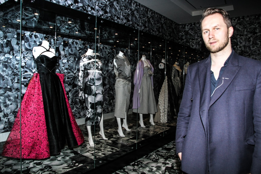 Toni Maticevski standing in the orchid room of the Bendigo Art Gallery