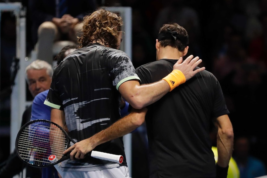 Roger Federer and Stefanos Tsitsipas embrace
