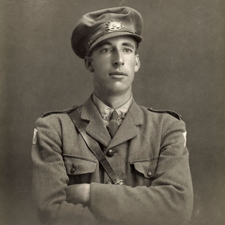 A black and white image of a young soldier in uniform