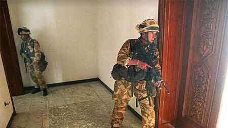 British troops patrol the seized presidential palace in Basra.