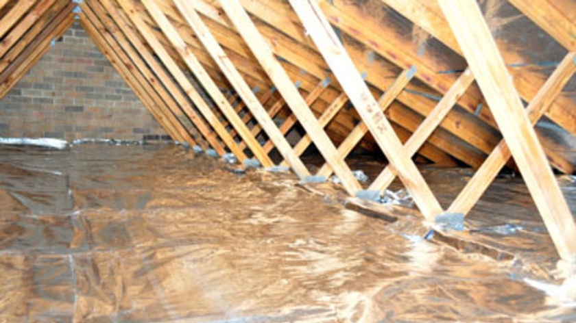 Foil insulation fills a roof cavity.
