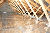 Foil insulation fills a roof cavity.