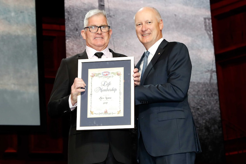 Merv Keane receiving his Australian Football Hall of Fame honour