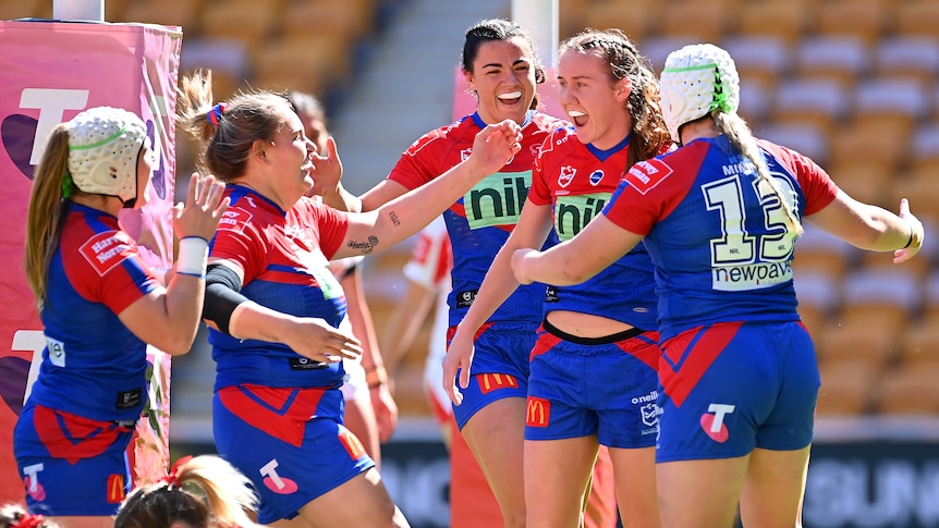 Newcastle's NRLW players celebrate a try