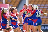 Newcastle's NRLW players celebrate a try
