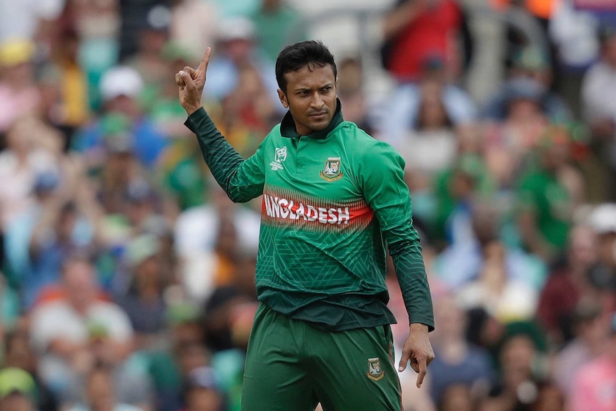 Shakib Al Hasan points to the sky with one hand, and the floor with another