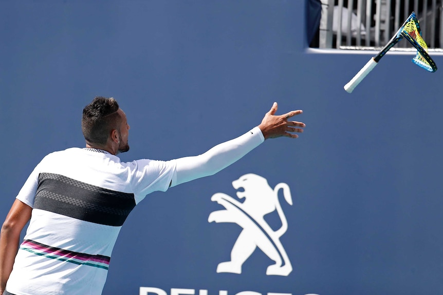 Nick Kyrgios throws his broken racquet to a spectator