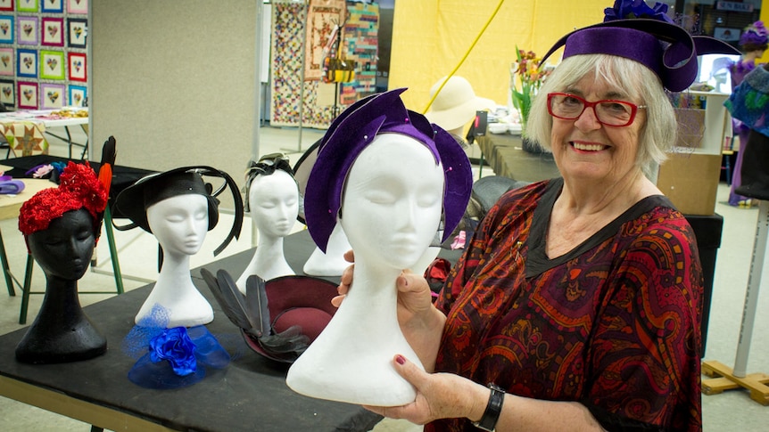 Riverland textile artist Lorraine Marter modelling the race day hat she created from a felt top hat.