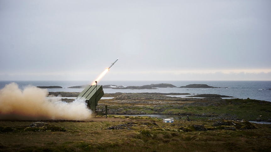A launcher firing a missile. 