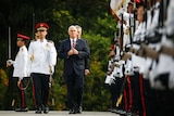 US Vice President Mike Pence flanked by military guard at the Singaporean Presidential Palace.