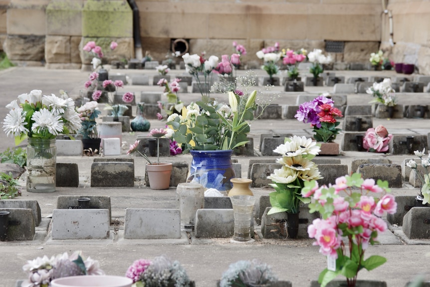 Graves with flowers on them.