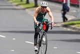 Keith Pearce cycling on the road in a New Zealand triathlon.