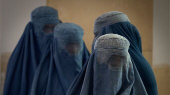 Afghan women in burqas wait in line at a polling station in Kabul (Getty Images/Paula Bronstein)