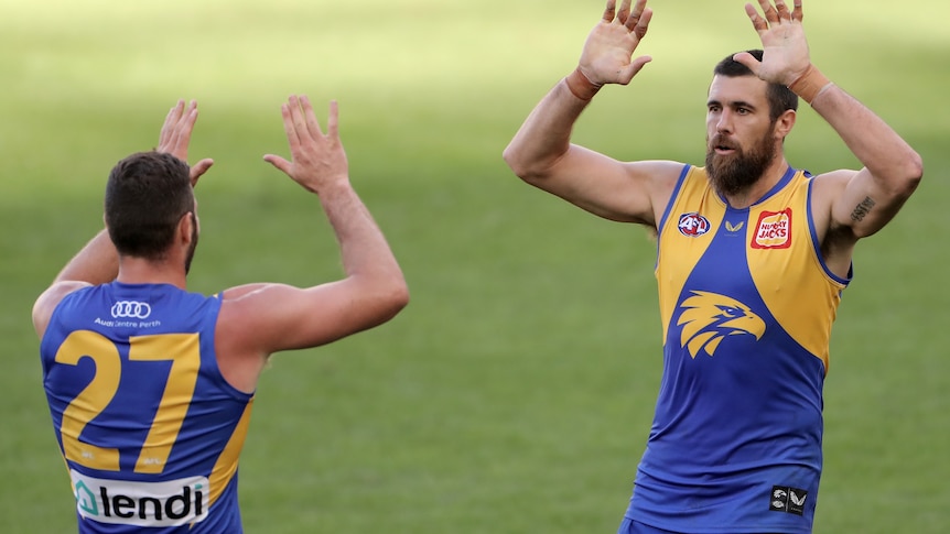 Josh Kennedy high fives Jack Darling after kicking a goal