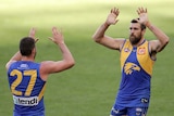 Josh Kennedy high fives Jack Darling after kicking a goal