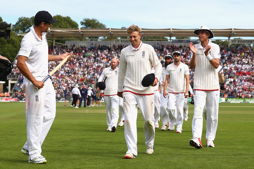 Alastair Cook, Joe Root and Stuart Broad of England after beating Australia in the first Ashes Test.