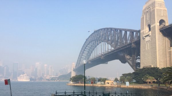 A view of the Sydney Harbour Bridge shrouded in smoke.