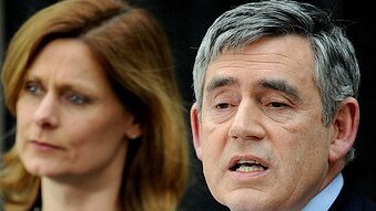 Gordon Brown stands with his wife Sarah as he announces his resignation as British prime minister (AFP/Ben Stansall)