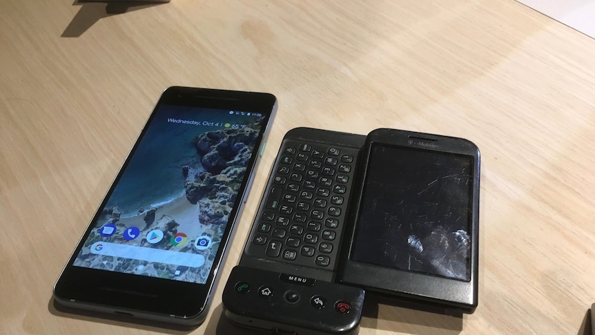 Google's new Pixel 2 phone sits next to an older smart phone.