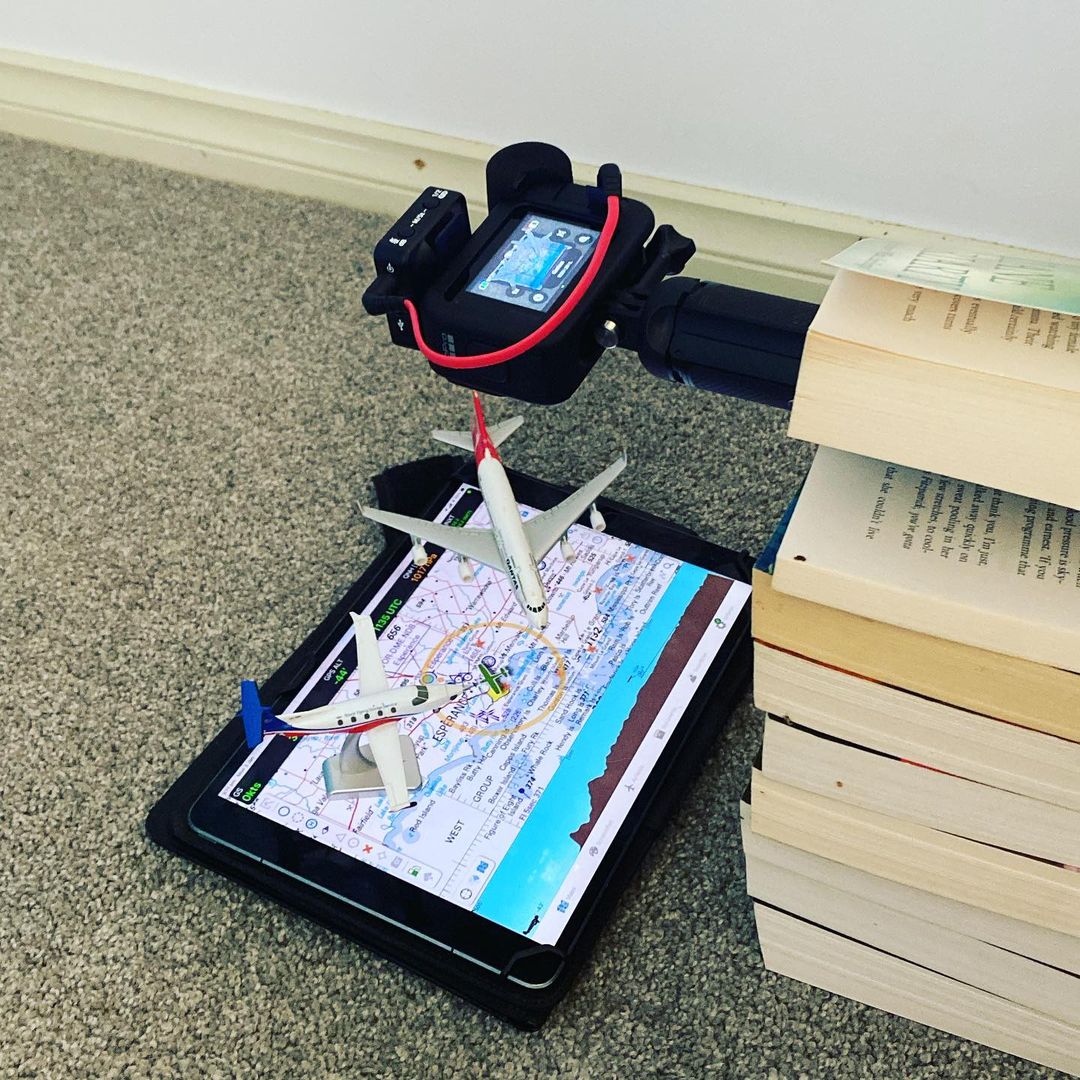 A GoPro filming a flight route on an iPad.