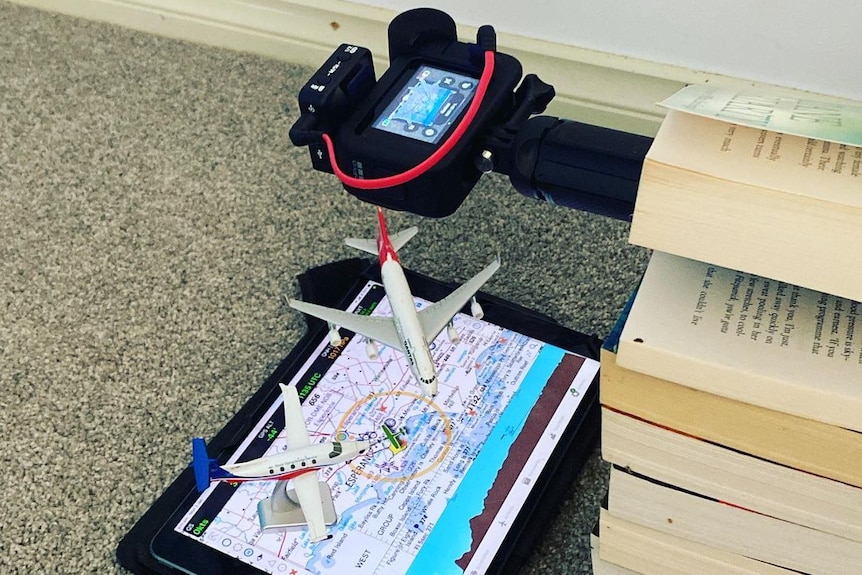 A GoPro filming a flight route on an iPad.