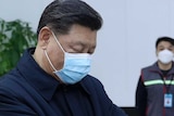Xi Jinping wearing a face mask and getting his temperature checked as he visits  community health centre in Beijing.