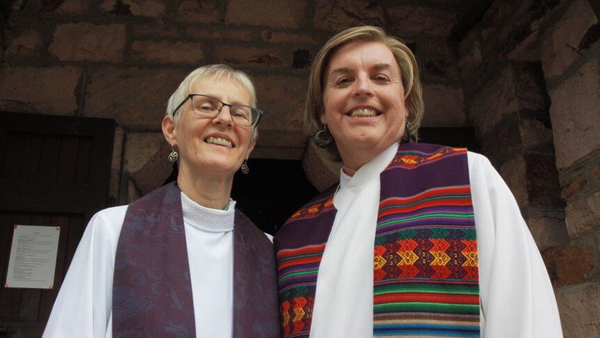 Australia's first openly transgender priest Jo Inkpin (right) and her wife Penny Jones.