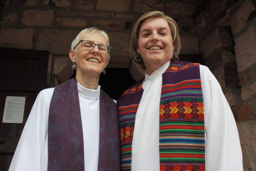 Australia's first openly transgender priest Jo Inkpin (right) and her wife Penny Jones.