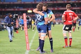 Burger Odendaal and JJ Engelbrecht celebrate a try for the Bulls against the Crusaders.