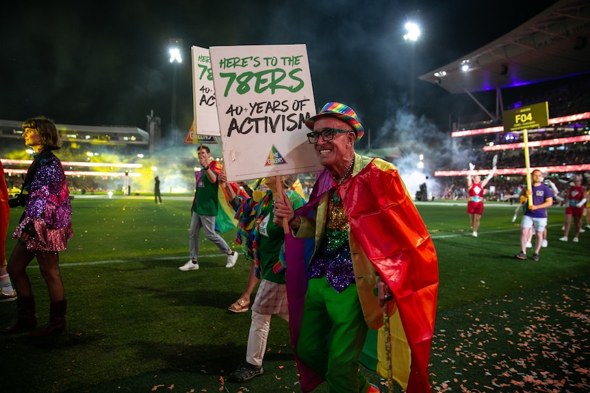 a man holding a sign