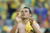Australia captain Mark Viduka claps the fans after the 2-0 loss to Brazil