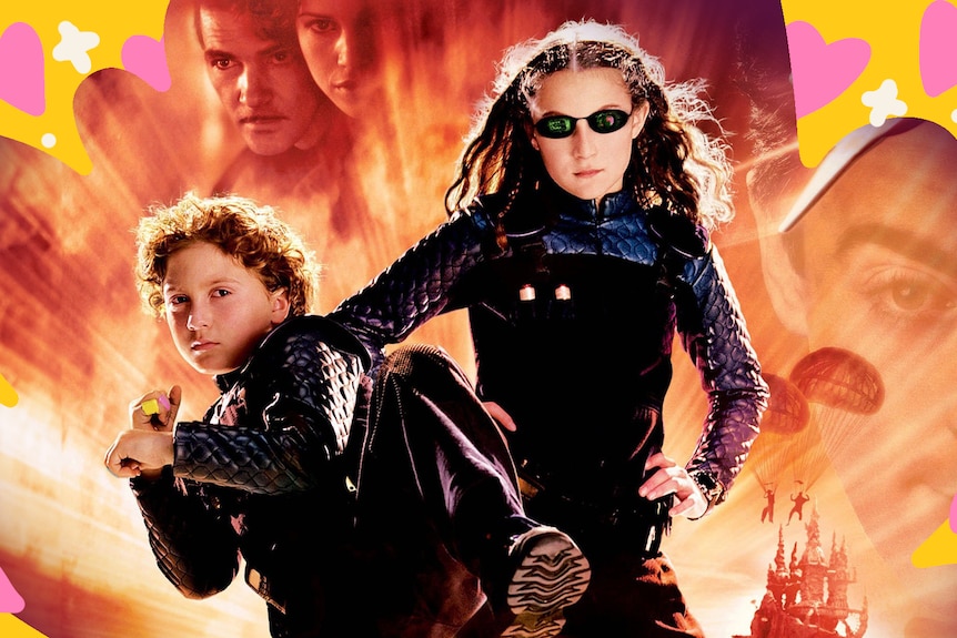 The poster for Spy Kids, with two children wearing sunnies doing martial arts.