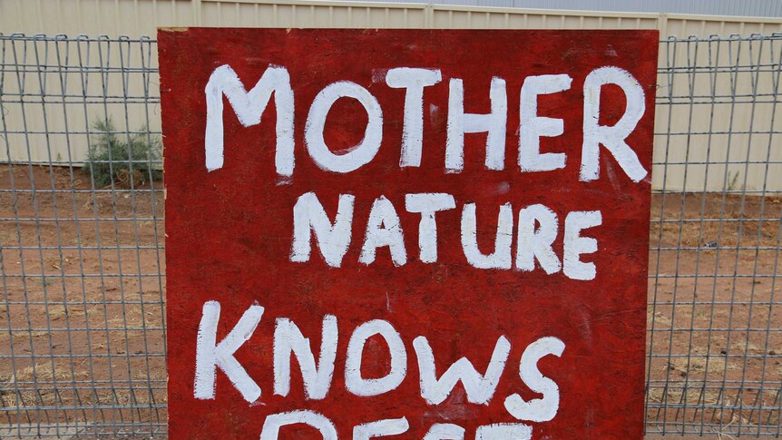 A handwritten sign reads "mother nature knows best"