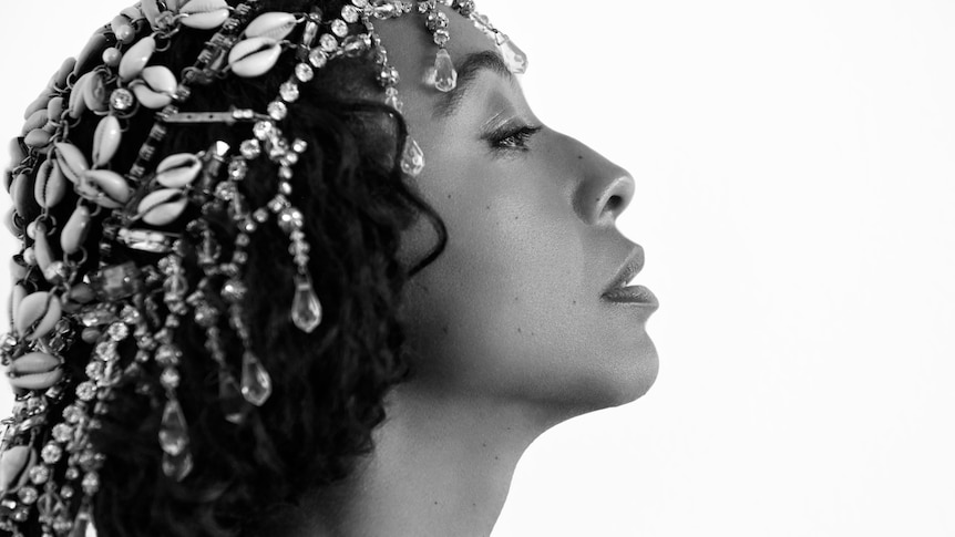 Close up black and white image of Corinne Bailey Rae wearing a headdress