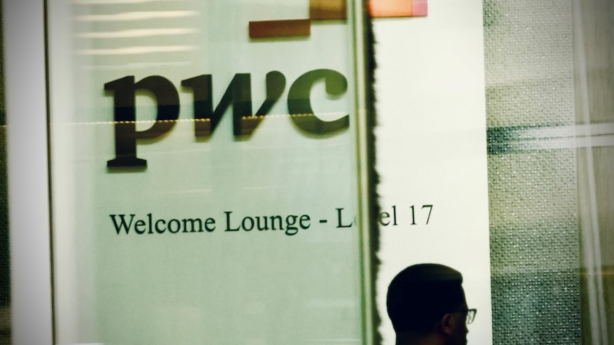 A three-letter logo "pwc" on a wall, with a head in shadow walking past beneath it.