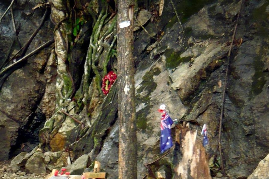 A memorial sits next to the railway lines at Hellfire Pass, a cutting on the Thai-Burma Railway, Thailand.