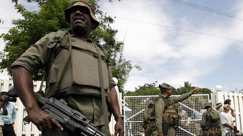 Fijian soldiers patrol then prime minister Laisenia Qarase's home on December 5, 2006.