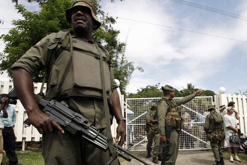 Fijian soldiers patrol then prime minister Laisenia Qarase's home on December 5, 2006.