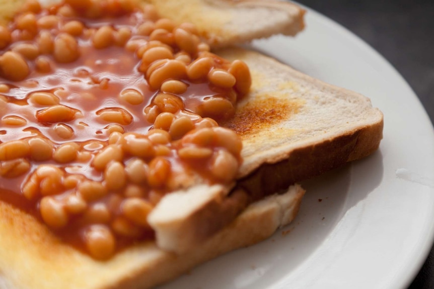 Close up of baked beans on toast.