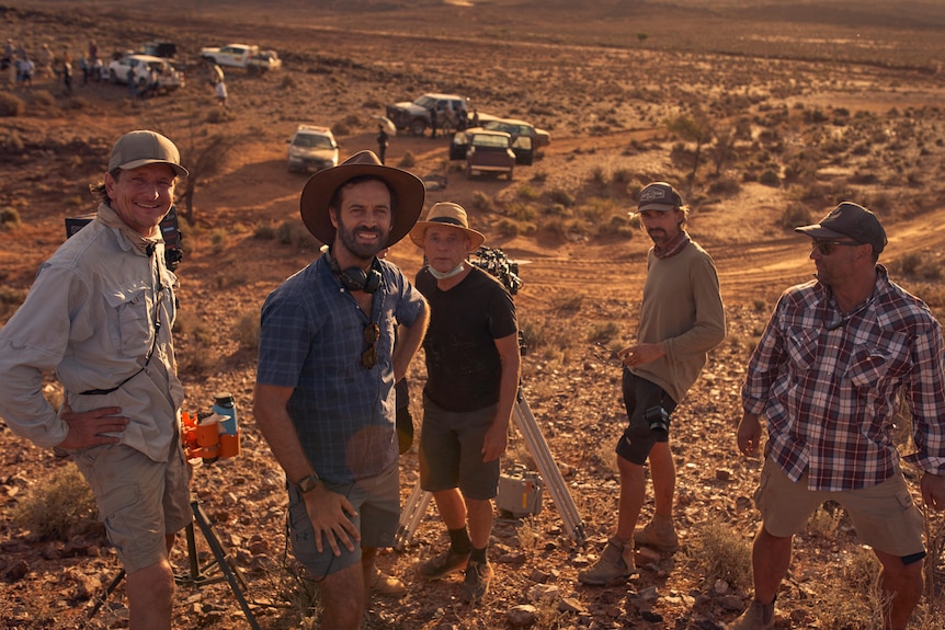 Director Benjamin Millepied and cast stand on set in Broken Hill 